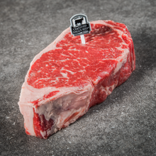 Load image into Gallery viewer, A timeless favorite of steak lovers, the New York Strip Steak is a boneless steak, richly marbled and tender.