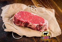 Load image into Gallery viewer, A timeless favorite of steak lovers, the New York Strip Steak is a boneless steak, richly marbled and tender. Cut from our well-aged Certified Angus Beef ® Striploins, this is one of our most popular grilling steaks.