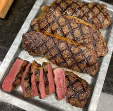 Load image into Gallery viewer, A timeless favorite of steak lovers, the New York Strip Steak is a boneless steak, richly marbled and tender. Cut from our well-aged Certified Angus Beef ® Striploins, this is one of our most popular grilling steaks.