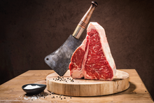 Load image into Gallery viewer, This delicious Certified Angus Beef ® steak features both the New York Strip AND the Tenderloin Filet - what more could you ask for? A traditional favorite, our T-Bone is the best of both worlds! And at 1 1/4 lbs. each, it will satisfy even the heartiest of appetites!